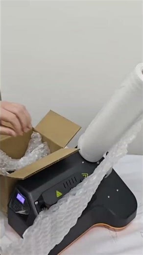 Making bubble wrap to protect fragile items during packing and shipping today at home carefully.