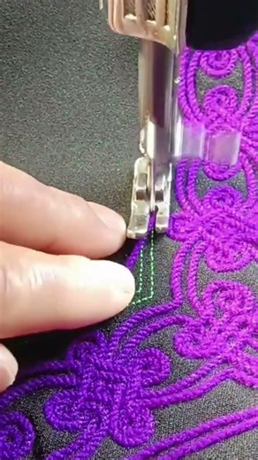 sewing on a cloth to create a motif is done manually by an expert #automobile