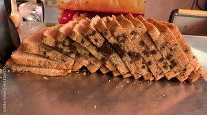 Close-up moldy brown bread slice, Fungi and bacteria in a brown bread slice, Dangerous slices of mold-covered bread, mold in bread.