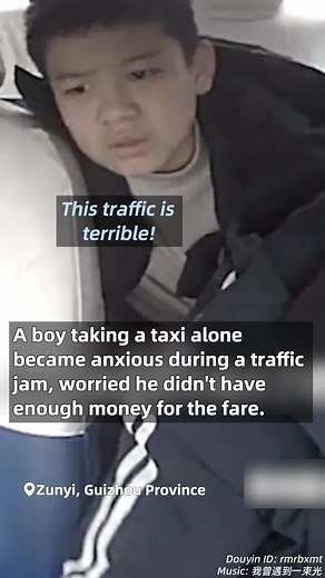 A boy taking a taxi alone became anxious during a traffic jam, worried he didn't have enough money for the fare. The driver comforted him the whole way. #HeartofChina #SparksofKindness