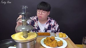 Guy loaded cheese in chocolate fountain machine