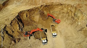 Heavy Equipment.Loader Excavator.Aerial View. Loading sand excavating in heavy
