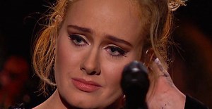 Adele breaks down while performing George Michael's "Fastlove" at the Grammys -- watch
