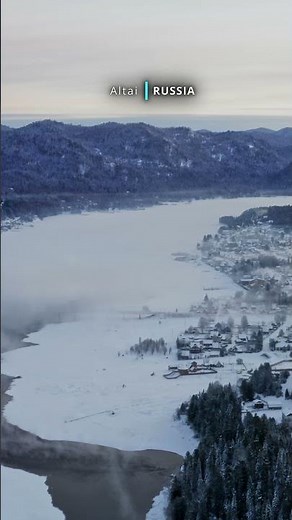 Aerial cinematic view of snow covered beautiful Altai