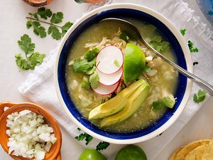 This shredded chicken and hominy-based Mexican stew is slow simmered with a salsa verde made with tomatillos, cilantro, and jalapeños giving this soup a beautiful green hue, and the pumpkin seeds add a nutty flavor and creamy texture. RECIPE: https://muybuenocookbook.com/chicken-pozole-verde/ | Muy Bueno Cookbook