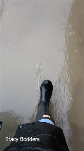 Mum Stacy Bodders filmed herself walking along a flooded school path in Tyldesley. Residents also saw their gardens submerged and they're blaming it on the construction of controversial warehouses. | Wigan Today