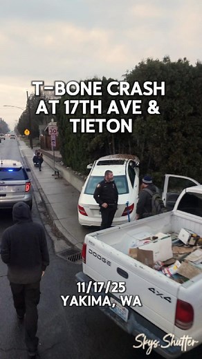 T-bone collision at 17th Ave & Tieton today (11/17/25). A pickup heading west on Tieton hit a Mercedes crossing north on 17th, pushing it up a retaining wall, into the shrubs, and knocking down a stop sign. Thankfully no major injuries reported — one driver was limping and someone nearby brought him crutches. #Yakima #Washington #StaySafe #CarCrash #LocalNews | Sky’s Shutter