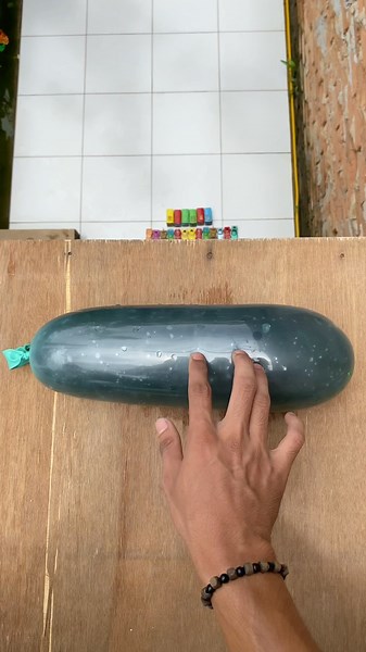 Experiment: Dropping long water balloons and emoji water balloons from a height