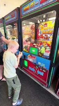 Caleb playing claw machine WinCo 4/20/26