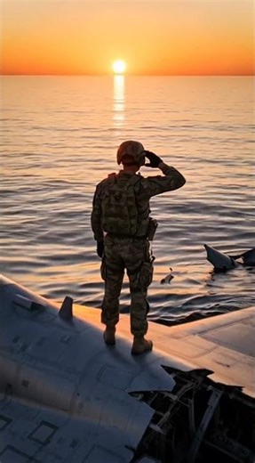 “From Beneath the Waves… He Saluted the Fallen”