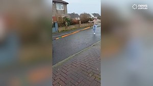 Man pulls car in bizarre way
