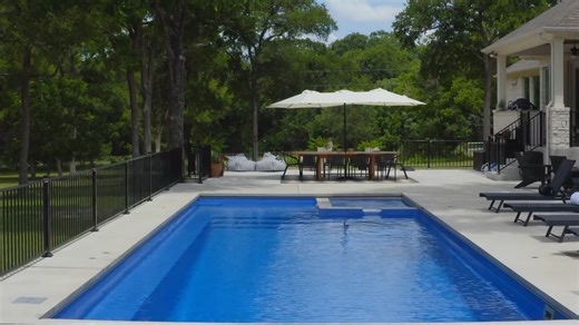 Aquamarine Pools on Instagram: "Transform your backyard into a luxurious oasis with The Intrigue model pools. This stunning design seamlessly combines a spacious swimming area, a generous splash pad, and a built-in spa, all complemented by a full-length bench for ultimate relaxation. Available in three lengths—40’, 35’, and 30’—The Intrigue offers versatility to fit your outdoor space perfectly. Call us at 800-432-8994 or get your free quote at aquapools.com."