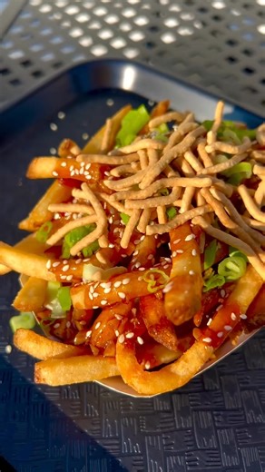 Sticky Tallow Fries: Tallow fries coated in General Tso’s sticky sauce topped with sesame seeds, scallions, and chow mein noodles. Only available until 8/31! | 1950 Originals