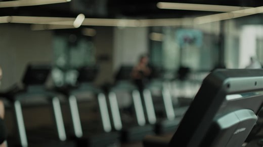 Woman stretching before workout on treadmill - Free Stock Video