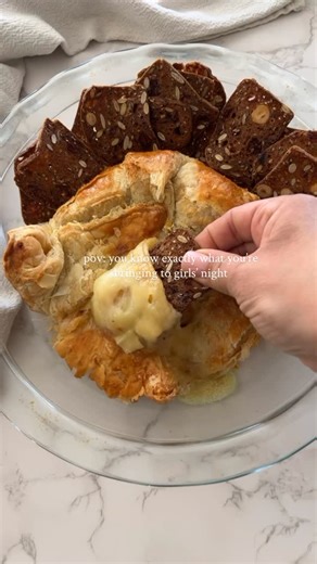 Jacqueline Vignona | Easy & Delicious Recipes on Instagram: "PUFF PASTRY BAKED BRIE 🧀 The ultimate girls night appetizer: warm, gooey baked brie wrapped in golden puff pastry with a sweet jam surprise inside. It’s simple, elegant, and always a hit—because cheese wrapped in pastry is never a bad idea. 🧀✨ Start by thawing a sheet of puff pastry dough & placing a wheel of brie cheese in the center. Score the brie (this is essential to get the gooey center when you cut into the dough). Top the che