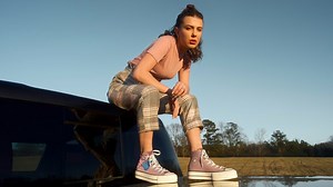 Millie Bobby Brown sitting on a car Rare Gallery wallpaper