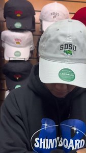 The perfect accessory for a sunny day 🧢 Get your SDSU hat now. Available in various styles and colors in-store and online at shopaztecs.com! #SDSU #SDSUBookstore #SanDiegoState | SDSU Bookstore