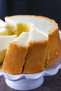 One of my favorites, this simple Chiffon Cake can be enjoyed on its own or topped with any of your favorite glaze or icing ❤️ . https://www.womanscribbles.net/vanilla-chiffon-cake/ . #foodblogfeed #foodandwine #bonappetit #bakinginspo #vanillacake #chiffoncake #bakefromscratch #cakes | Woman Scribbles - Desserts and Pastries Recipe Blog