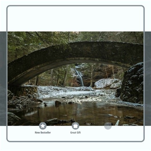 "Winter’s Whisper" // https://www.cawphotographystudio.com/warehouse-open-edition-prints/art_print_products/20250104-hockinghills-222-gp Discover the enchanting beauty of Lower Falls in Hocking Hills State Park with this captivating artwork. A serene winter scene unfolds as a tranquil river flows beneath a gracefully arched stone bridge, leading to a stunning waterfall nestled within the forest. The artwork conveys a soothing atmosphere through cool winter tones, inviting a sense of peace and ca