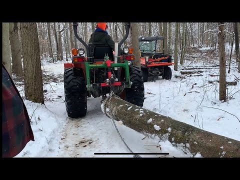 162 Skidding logs with compact tractor