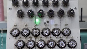 The working process of an industrial sewing machine for applying patterns to a fabric surface.