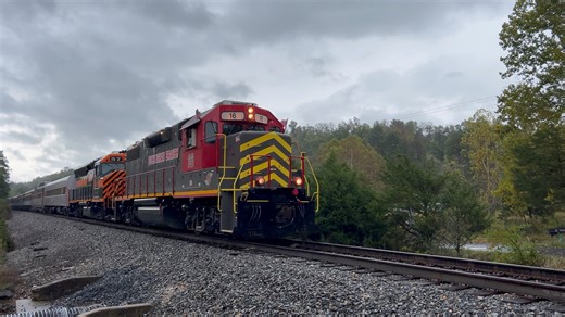 Buckingham Branch GP38-2 16 and former MARC GP40WH-2 57 lead the Shenandoah Valley Limited to Goshen, Virginia. The 14-car train includes a California Zephyr dome, a matching set of cars from the Steam Railroading Institute, and the Norfolk & Western tool car 1407. | Dynamo Productions