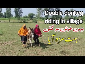Double woman ride on donkey in village | Donkey Rider lady