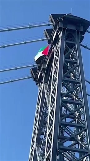 A large Palestinian flag was unfurled across the Brooklyn tower of the Williamsburg Bridge during the morning rush hour Monday. | New York Post