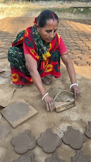 Making flower tiles from clay.