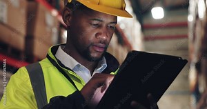 Warehouse engineer, black man and tablet to check stock, inventory or storage app. Factory worker, technology and inspection for quality control, logistics or cargo distribution in shipping industry Stock Video