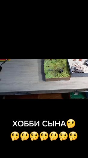 Miniature Battle Scene with Model Soldiers and Vehicles