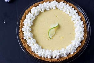 This Classic Key lime Pie is a favorite summertime dessert! It's easy to make, creating a smooth and creamy lip-puckering filling for the graham cracker crust. Find the Recipe here: https://aclassictwist.com/classic-key-lime-pie-recipe/ | A Classic Twist