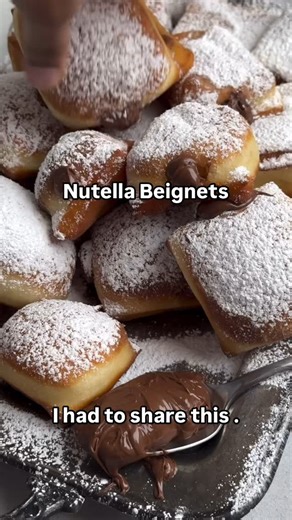 Nutella Beignets – The Sweet Treat You Didn’t Know You Needed! Recipe by @britneybreaksbread Fluffy, golden beignets filled with warm, gooey Nutella? Say less. These are the must-make treat for Memorial Day weekend—crispy on the outside, chocolatey on the inside, and gone in seconds. 📌 SAVE this now & impress your weekend crew! 👉 Follow @foodiebawse for more viral recipes and indulgent bites. #NutellaBeignets #BeignetLovers #beignet #nutella #MemorialDayDesserts #FoodieBawse #delicious #desser