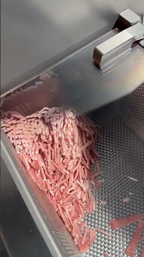 Watch the sharp meat slicer quickly cut meat slices into strips