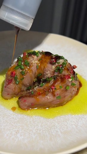 Tonight I made wagyu carpaccio shaped like a tortellini! I am so excited with how this turned out. Surprisingly, the process was a lot easier than I was anticipating. I started out with a gorgeous piece of A5 wagyu from @Alpine Butcher 🥩 I flattened the wagyu then sliced it into a large circle. I fried the extra pieces to add into an arugula salad. For the salad I used baby arugula, micro arugula, evoo, freeze dried garlic, yuzu vinegar, and a little bit of salt! I also added those wagyu cubes 