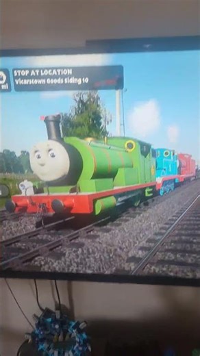 James, Thomas and Percy pulling a goods train