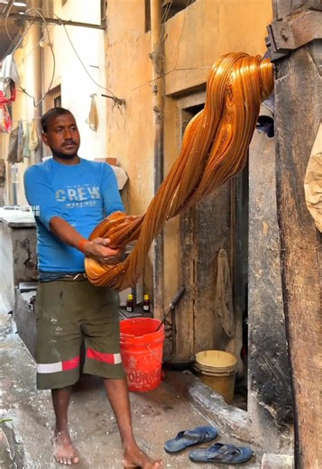 We’re in Bangladesh watching these vendors make hand made candy 🇧🇩🍭 Would you try it? 🤷🏽‍♂️ With @foodie.empire85 #fyp #foryou #candy #bangladesh #foodporn