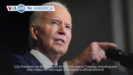 VOA60 America - President Biden signs 50 bills into law