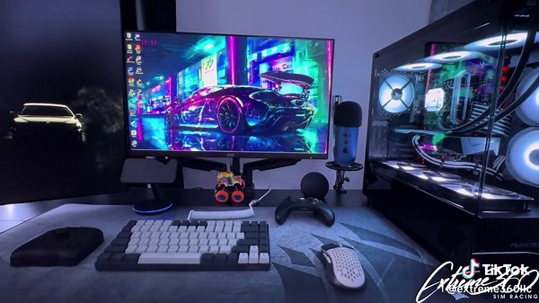 Ultimate Gaming Setup with Dual Gaming PCs and Sim Racing Rig
