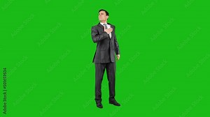 Serious man putting hand on chest and looking away