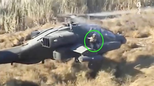 Soldier MedEvac On Apache Wing