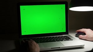 clip-8835616-man-use-laptop-on-his-desktop-various