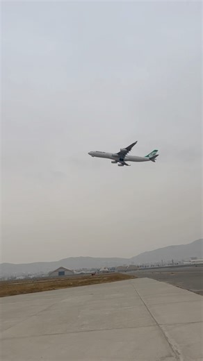 Airbus A340 taking off from the runway Four engines lifting into flight