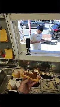Making 2 Chili Chesses Dogs for a customer at Devil Dogs in North Arlington NJ