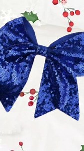 A cheerleading bow is a great way to complete a cheerleader's look. Our Cheer bows are available for quick shipping and are perfect for the sidelines or the competiton mat. Size; 5 inches Materials: sequined ribbons Attached to clip ... | Xai Ribbons And Crafts | Facebook