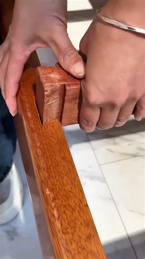 Assembling wooden furniture using traditional joinery techniques to create a sturdy and lasting piec
