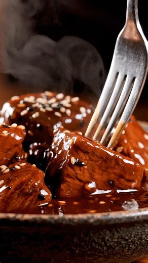 The Glossy Beef Cube That Broke the Internet Ingredients: - 2 lbs beef chuck, cut into 1-inch cubes 🥩 - 1/4 cup soy sauce 🍶 - 1/4 cup oyster sauce 🍜 - 2 tbsp honey 🍯 - 2 tbsp cornstarch 🌽 - 1 tbsp vegetable oil 🛢️ - 1 tsp garlic powder 🧄 - 1 tsp onion powder 🧅 - 1/2 tsp black pepper 🧂 - 1/2 cup beef broth 🍲 - Optional: sesame seeds and chopped green onions for garnish 🌱 Directions: In a large bowl, combine the beef cubes with soy sauce, oyster sauce, honey, garlic powder, onion powder