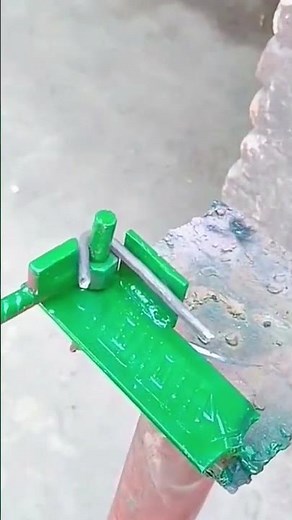 Bending steel rod manually using a small green bending tool