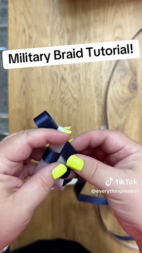Military braid for himecoming mums! My most common braid and its very easy! This is 2.5 yards of 9/16” satin acetate ribbon. This is my favorite width ribbon to use but you can do other widths as well. #homecomingmums #homecoming #texastraditions #everythingmums #mumtok #homecomingbraidtutorial #militarybraid