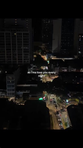 Aerial Nighttime Cityscape with Illuminated Buildings